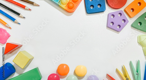 A layout of educational toys for small children in the form of sorters  pencils  mosaics  constructor on a white background