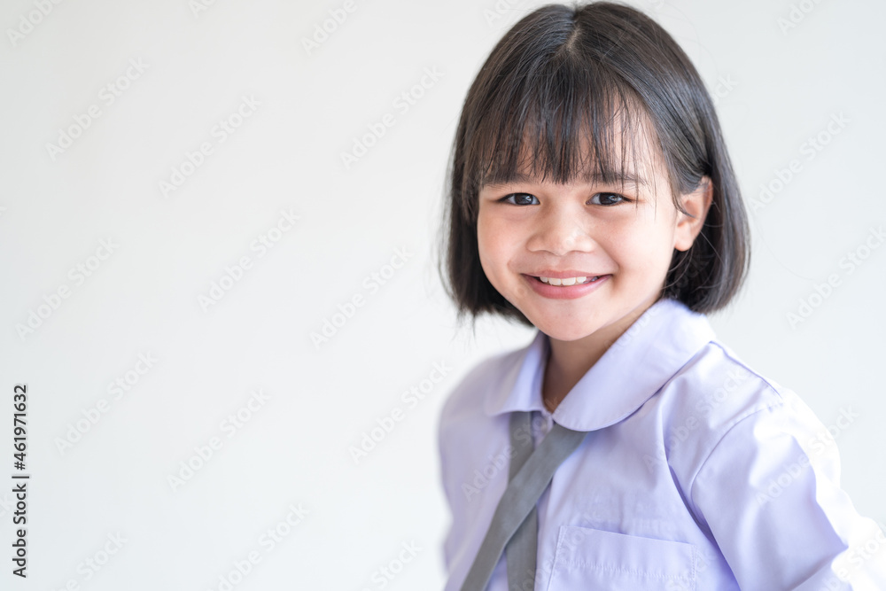 Portrait of a cheerful child student isolated on white background smiles and looks at the camera. Back to School Concept Stock Photo Portrait of a cheerful child student isolated on white background smiles and looks at the camera. Back to School Concept Stock Photo