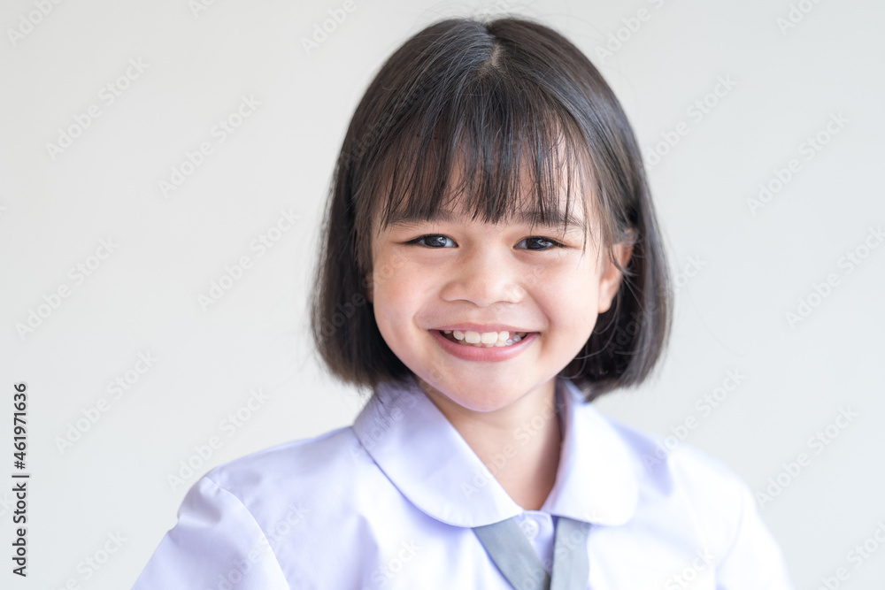 Portrait of a cheerful child student isolated on white background smiles and looks at the camera. Back to School Concept Stock Photo Portrait of a cheerful child student isolated on white background smiles and looks at the camera. Back to School Concept Stock Photo