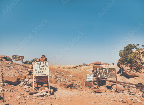 Old rusty signs with the end of the world coffee shop and best view at the end of Ed Deir trail, in Petra Jordan photo