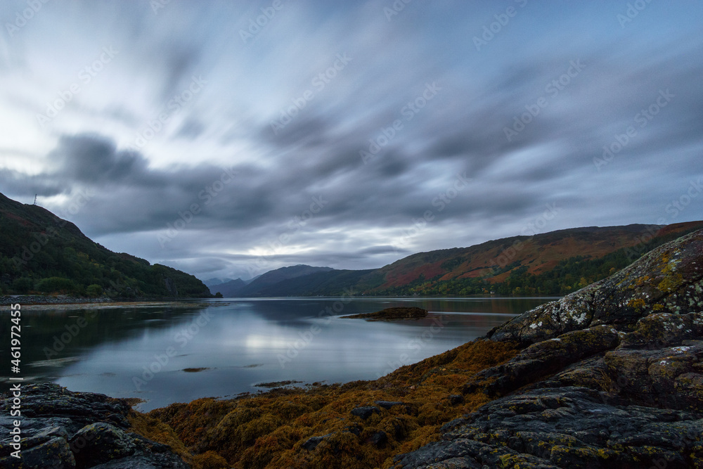 View from Loch Duich at Loch Alsh with moving clouds on morning before sunrise, Dornie, Scotland View from Loch Duich at Loch Alsh with moving clouds on morning before sunrise, Dornie, Scotland