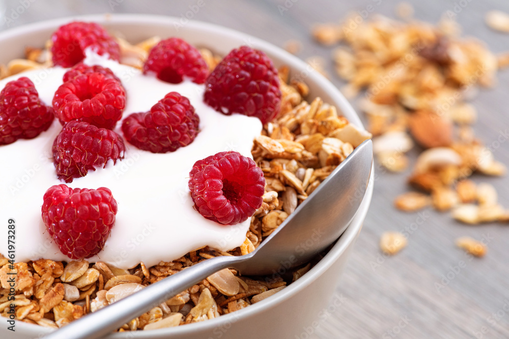 Sweet breakfast with granola, yogurt and fresh raspberries Sweet breakfast with granola, yogurt and fresh raspberries
