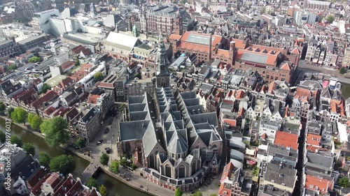 Aerial view of The Oude Kerk in English Old Church is Amsterdam’s oldest building and youngest art institutes it stands in De Wallen the main red-light district in Oudekerksplein 4k high resolution photo