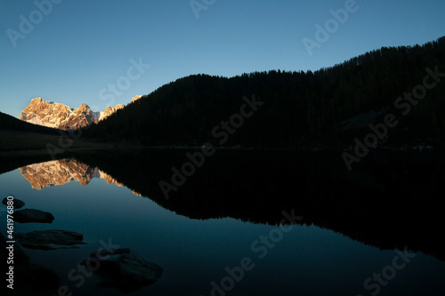 dolomites landscape and reflection on calaita lake