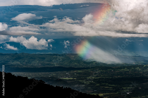 Cloudy sky and rainbow appeared.on the mountain Thailand
