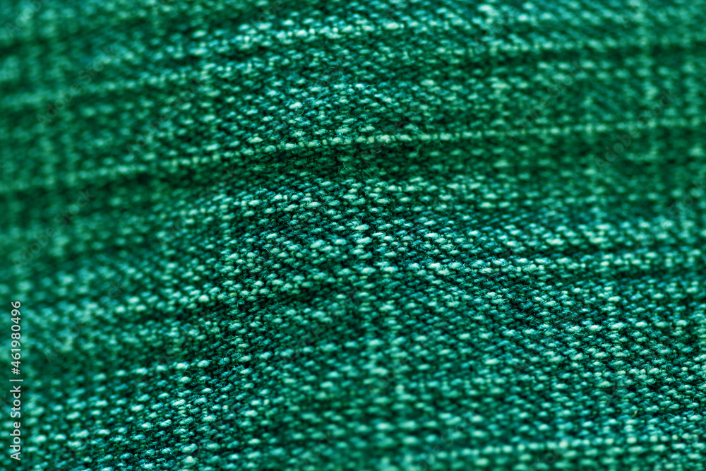 Green fabric textile texture close up , focus only one point , soft blured background