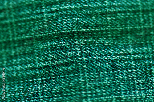 Green fabric textile texture close up   focus only one point   soft blured background