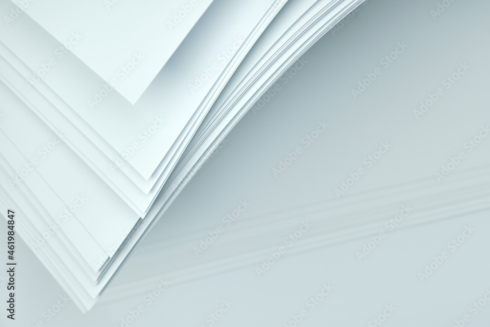 Corners of sheets of white paper on a white background. Abstract background. Corners of sheets of white paper on a white background. Abstract background.