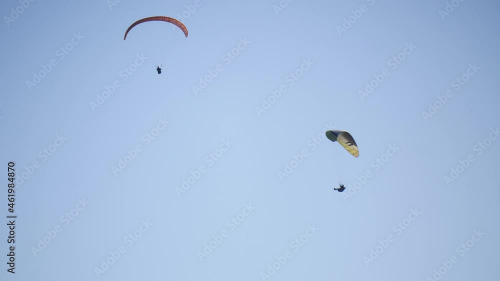 Paragliding. Extreme sport. Paraglider silhouette flying in the sky. Spain Alicante Santa Pola region. Paragliding. Extreme sport. Paraglider silhouette flying in the sky. Spain Alicante Santa Pola region.