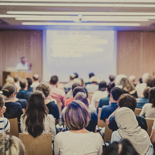 Audience in lecture hall on scientific conference.