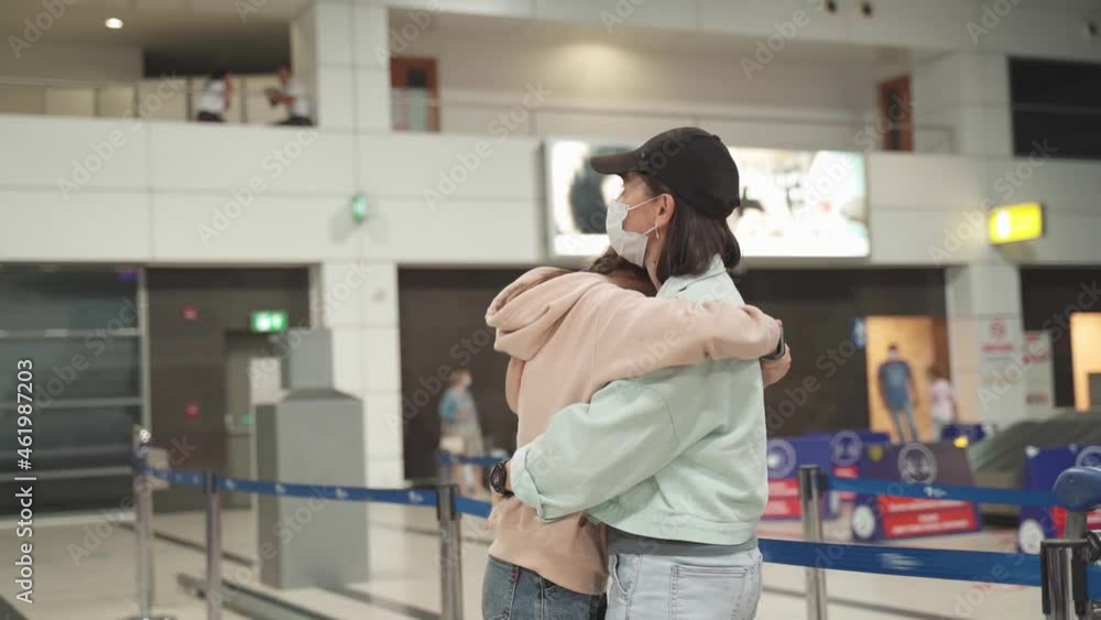 Mom and daughter hug in the airport building, railway station. Mom and daughter hug in the airport building, railway station.