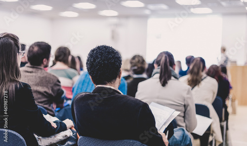 Woman giving presentation on business conference.