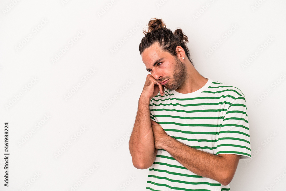 Young caucasian man isolated on white background who feels sad and pensive, looking at copy space. Young caucasian man isolated on white background who feels sad and pensive, looking at copy space.