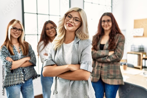 Group of young businesswoman smiling happy standing with arms crossed gesture at the office.