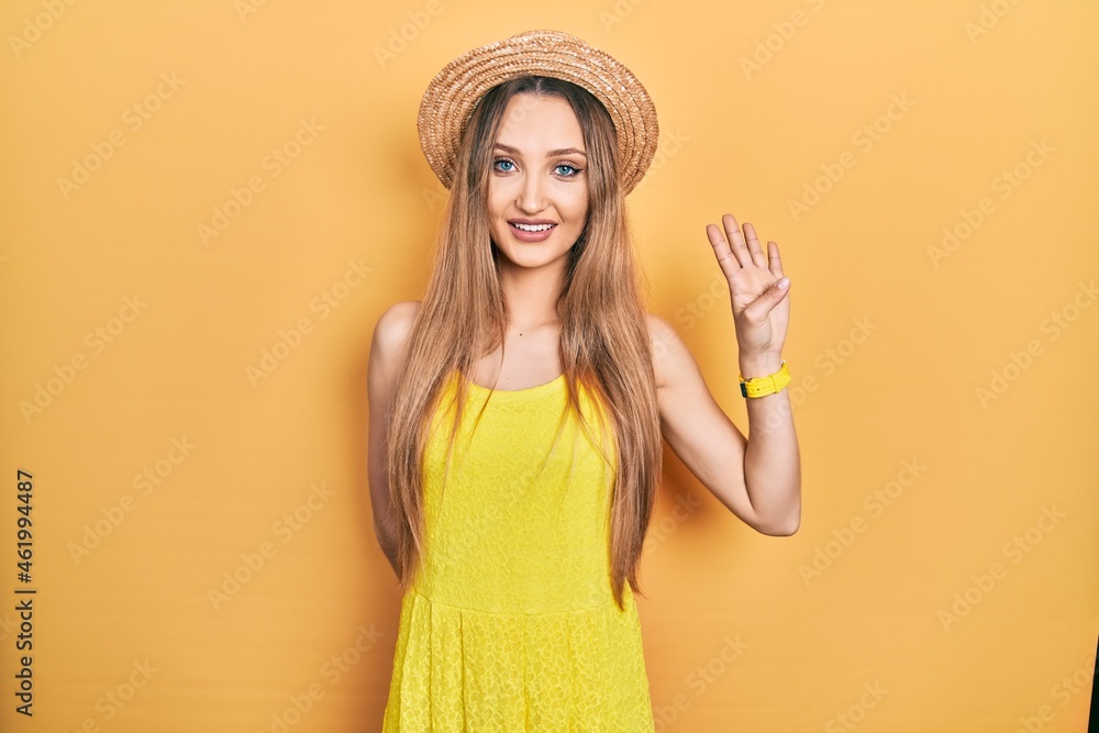 Young blonde girl wearing summer hat showing and pointing up with fingers number four while smiling confident and happy. Young blonde girl wearing summer hat showing and pointing up with fingers number four while smiling confident and happy.