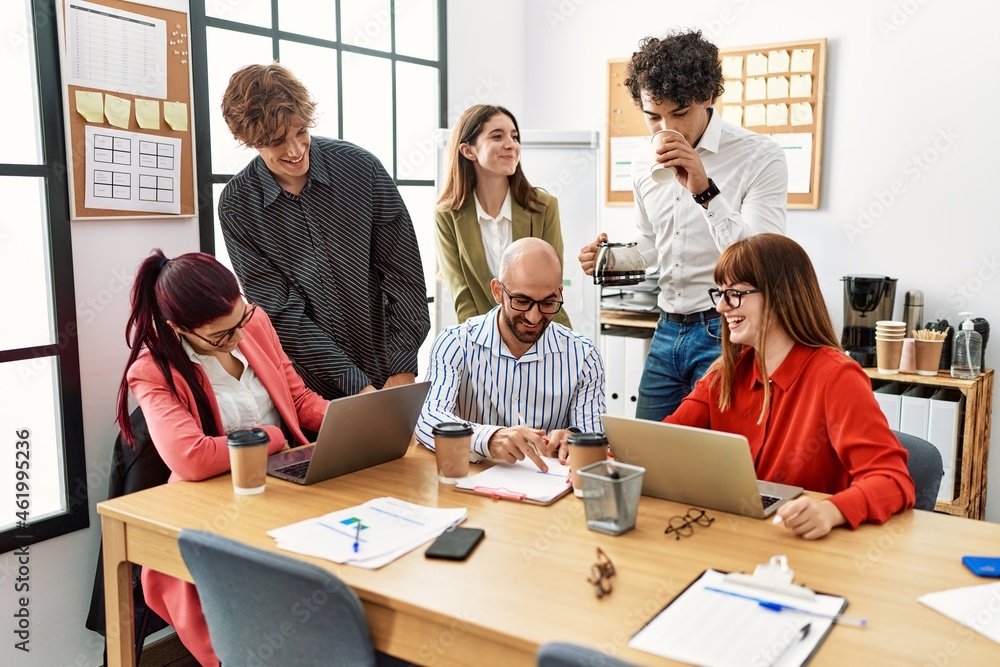 Group of business workers smiling happy working at the office. Group of business workers smiling happy working at the office.