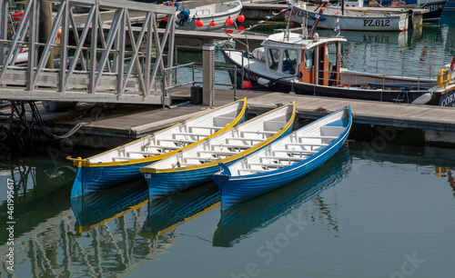 Wallpaper Mural Newlyn Harbour, Cornwall, England, UK. 2021.  Three pilot gig boats on  a jetty in Newlynn Harbour. Torontodigital.ca