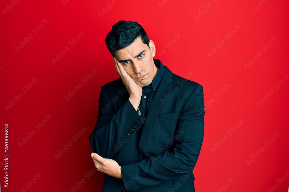 Handsome hispanic man wearing business clothes thinking looking tired and bored with depression problems with crossed arms. Handsome hispanic man wearing business clothes thinking looking tired and bored with depression problems with crossed arms.