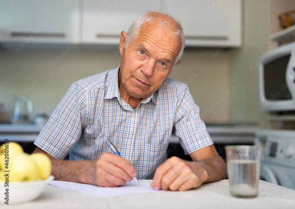 Old man writing letter Old man writing letter