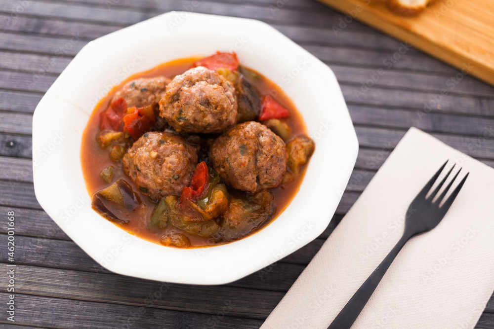 cooked meatballs with stewed eggplant in bowl cooked meatballs with stewed eggplant in bowl