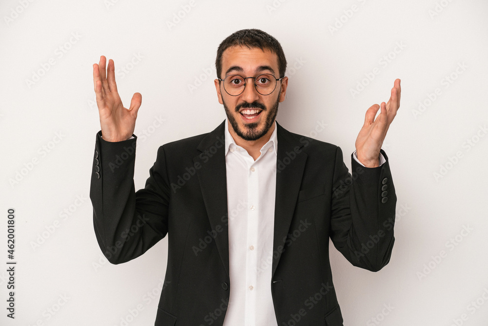 Young caucasian business man isolated on white background receiving a pleasant surprise, excited and raising hands. Young caucasian business man isolated on white background receiving a pleasant surprise, excited and raising hands.
