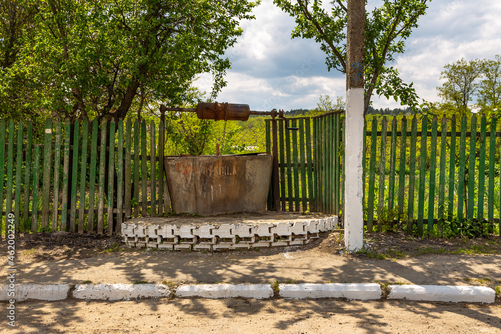 Old well casing, water intake point by the roadside. Dezghingea, Gagauzja, Republic of Moldova. Old well casing, water intake point by the roadside. Dezghingea, Gagauzja, Republic of Moldova.