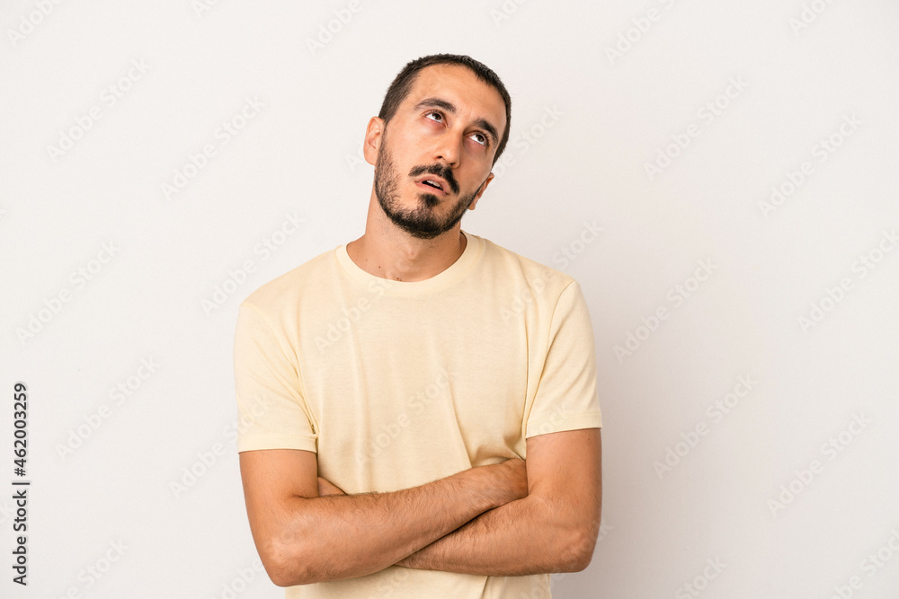 Young caucasian man isolated on white background tired of a repetitive task. Young caucasian man isolated on white background tired of a repetitive task.