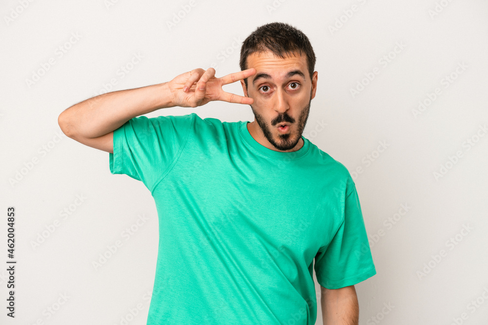 Young caucasian man isolated on white background dancing and having fun. Young caucasian man isolated on white background dancing and having fun.