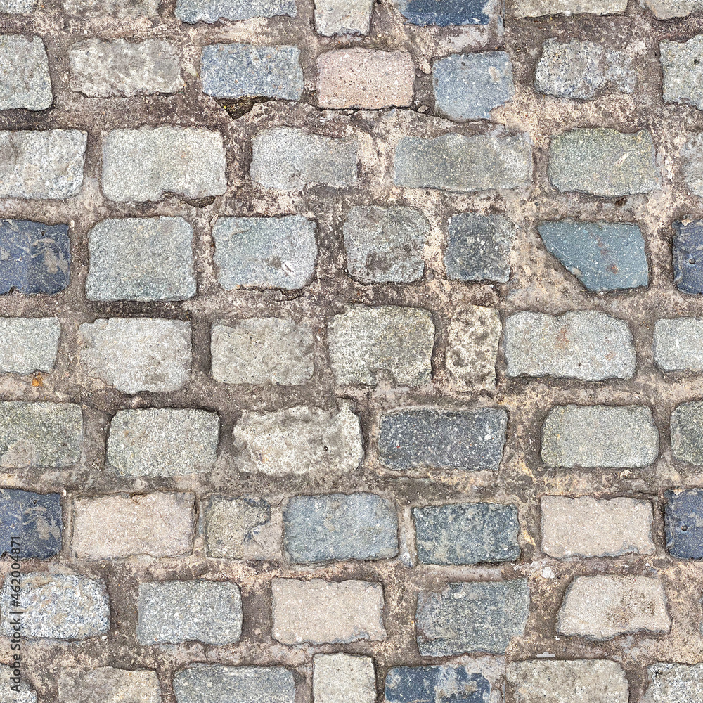 Granite cobblestoned pavement background. Stone pavement texture. Abstract background of cobblestone pavement close-up. Seamless texture. Granite cobblestoned pavement background. Stone pavement texture. Abstract background of cobblestone pavement close-up. Seamless texture.