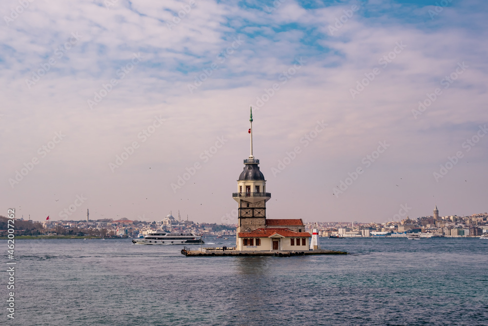 Maiden's Tower (Kiz Kulesi) in Istanbul Bosphorus. Tower is one of the most well-known symbols of Istanbul. Blue sky and natural white clouds on Bosphorus