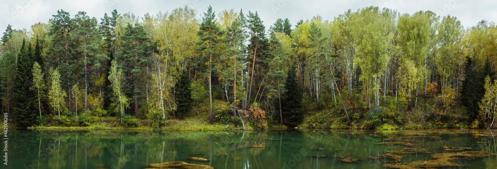 Panorama of autumn lake in the middle of forest. Panorama landscape. Panorama of autumn lake in the middle of forest. Panorama landscape.