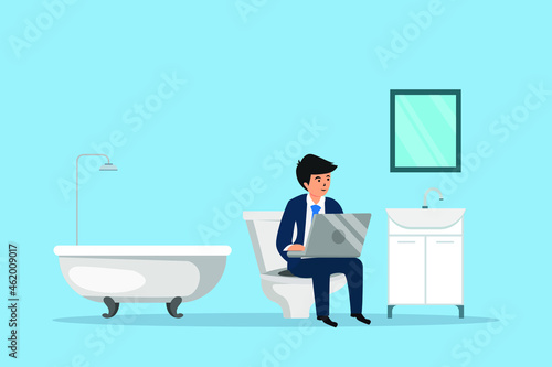 Businessman working with a laptop while relaxing in the bathroom