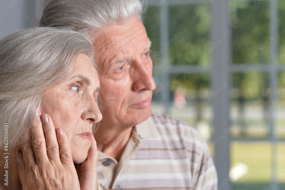 Portrait of sad senior couple posing at home Portrait of sad senior couple posing at home