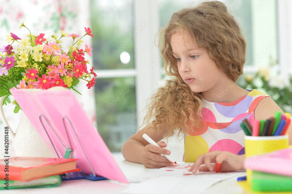 cute girl doing home work at desk cute girl doing home work at desk