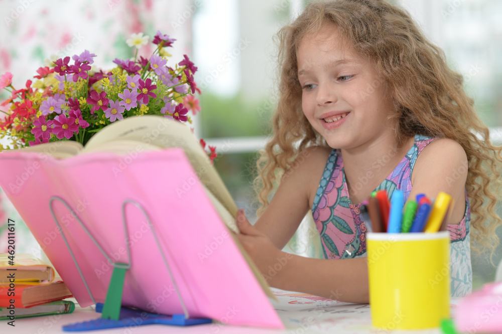 cute girl doing home work at desk cute girl doing home work at desk