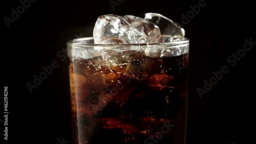 Solt drink being poures into a glass with ice, FHD formate