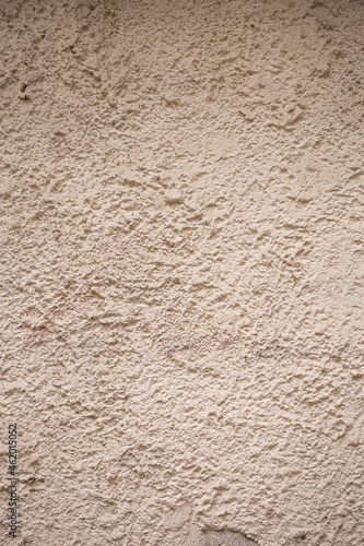 close up beige textured cement and sand wall