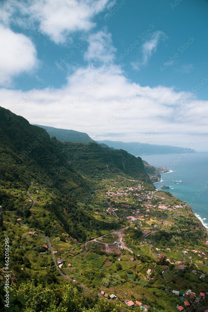 Green Mountains and a Small Village by the sea seen from 