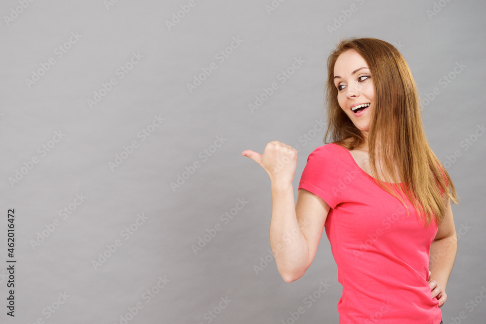 Woman pointing, surprised face expression Woman pointing, surprised face expression
