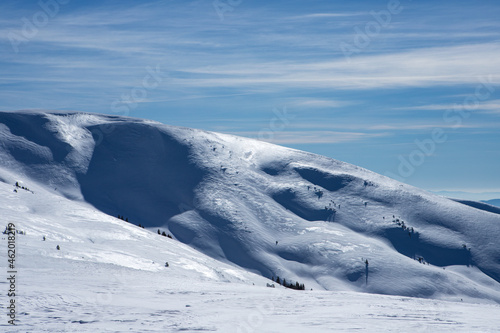 Mountain slopes covered with snow. © Vitalfoto