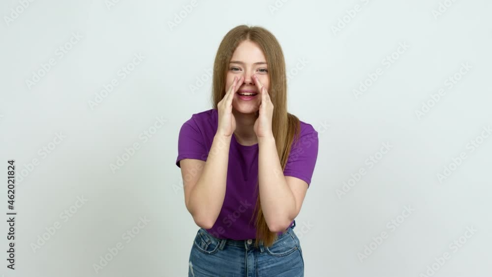 Teenager girl shouting and announcing something over isolated background Teenager girl shouting and announcing something over isolated background