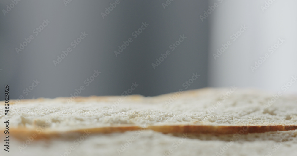 fresh baguette slice to make sandwich closeup fresh baguette slice to make sandwich closeup