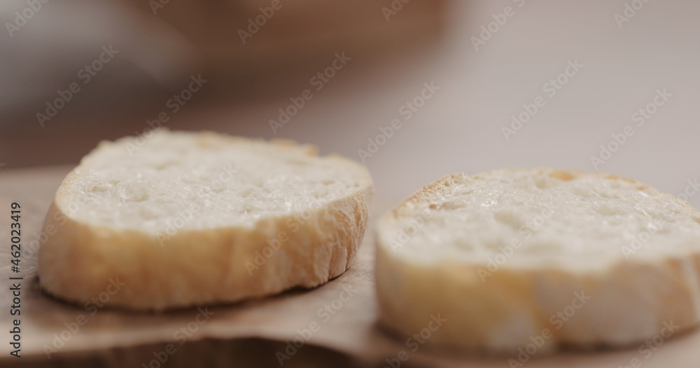 slices of rustic ciabatta on olive wood board slices of rustic ciabatta on olive wood board