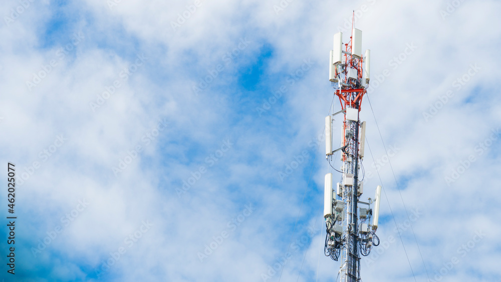 Transmission and communication towers made of steel. Under the blue sky with white clouds. Transmission and communication towers made of steel. Under the blue sky with white clouds.