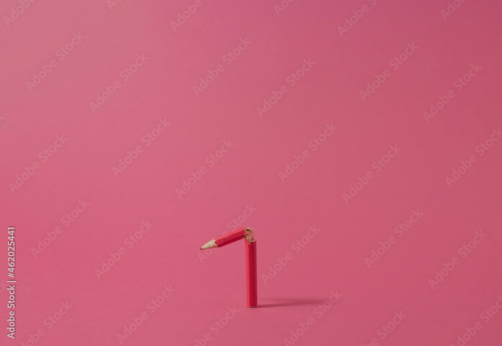 Broken pink wooden crayon on the pink background. Minimal concept. Broken pink wooden crayon on the pink background. Minimal concept.
