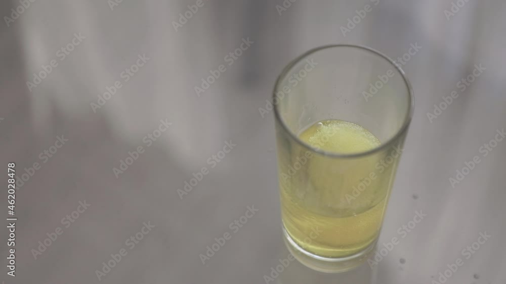 Dropping down a effervescent tablet vitamin C for health, bubbles in Slow motion Dropping down a effervescent tablet vitamin C for health, bubbles in Slow motion