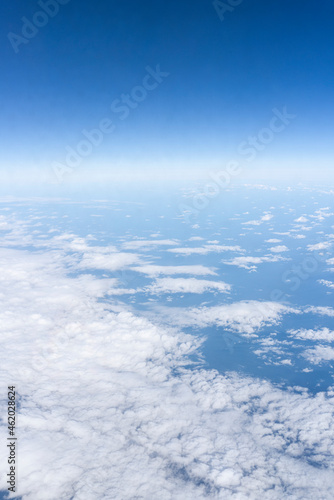 beautiful blue sky and clouds, view from the airplane window, horizontal photo