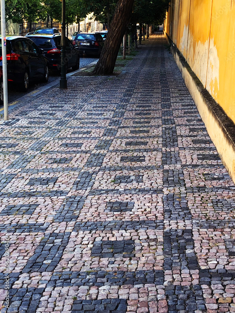 Fototapeta premium Long cobblestone sidewalk in Europe