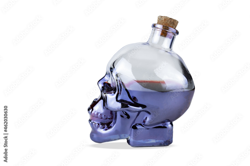 Skull shaped glass bottle with cork with purple liquid inside, isolated on white background Skull shaped glass bottle with cork with purple liquid inside, isolated on white background