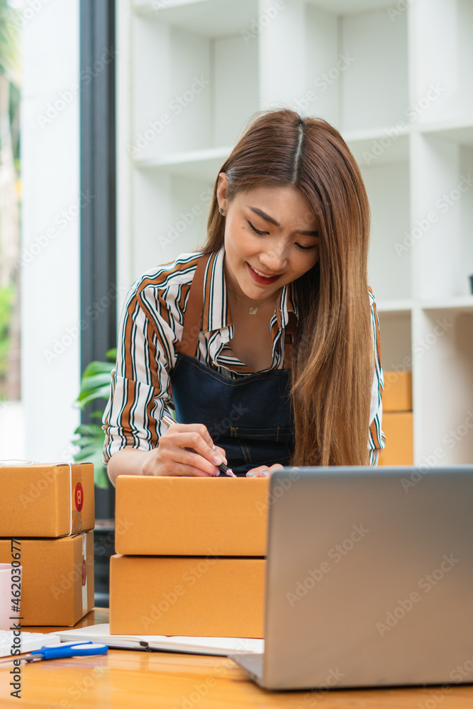 Young startup small business entrepreneur woman working with computer laptop at home, Online business, ecommerce and delivery concept. Young startup small business entrepreneur woman working with computer laptop at home, Online business, ecommerce and delivery concept.